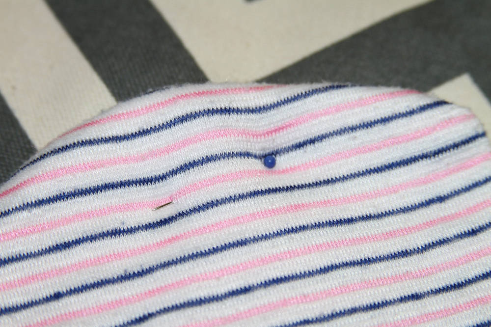 Baby hat attached with pin close up