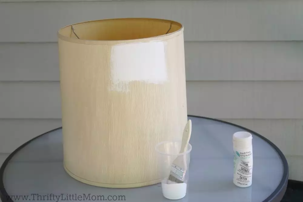 Painting a lamp shade white on a table