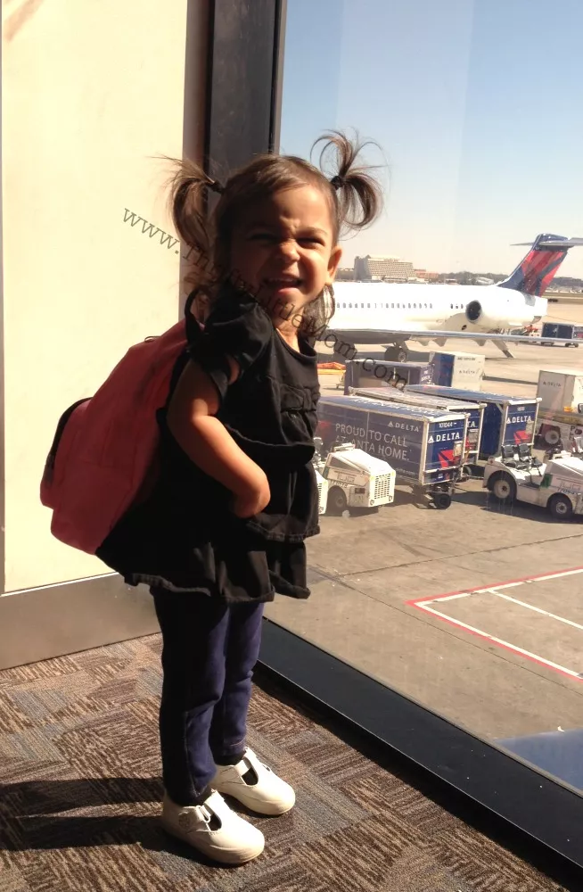 How To Survive Flying with young children. If you are going to be flying with kids for the first time or the 10th time, be sure you read this post for sanity saving packing lists, activities and tips! 