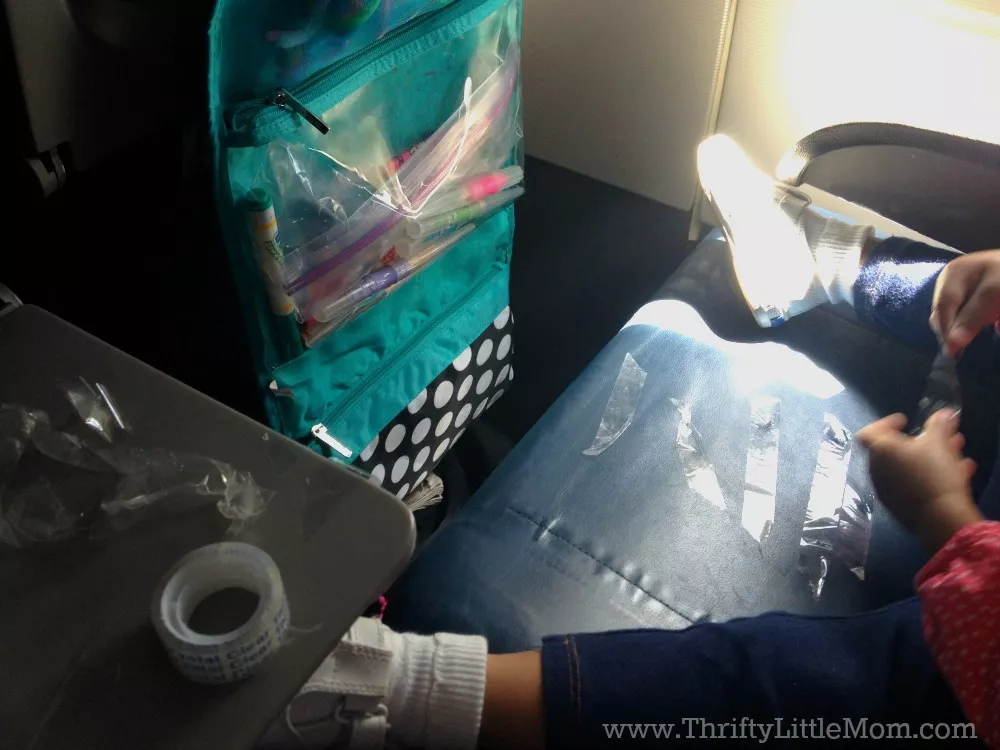 How To Survive Flying with young children. If you are going to be flying with kids for the first time or the 10th time, be sure you read this post for sanity saving packing lists, activities and tips! 