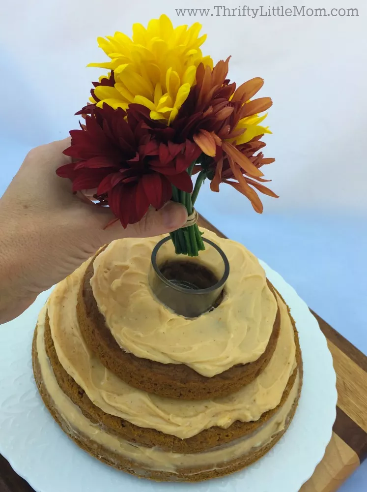adding-flowers-to-a-naked-cake