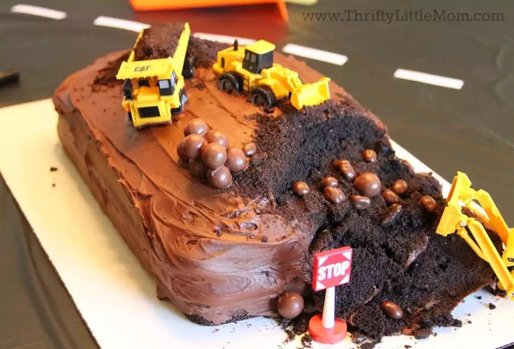 construction trucks on cake for 5th birthday party
