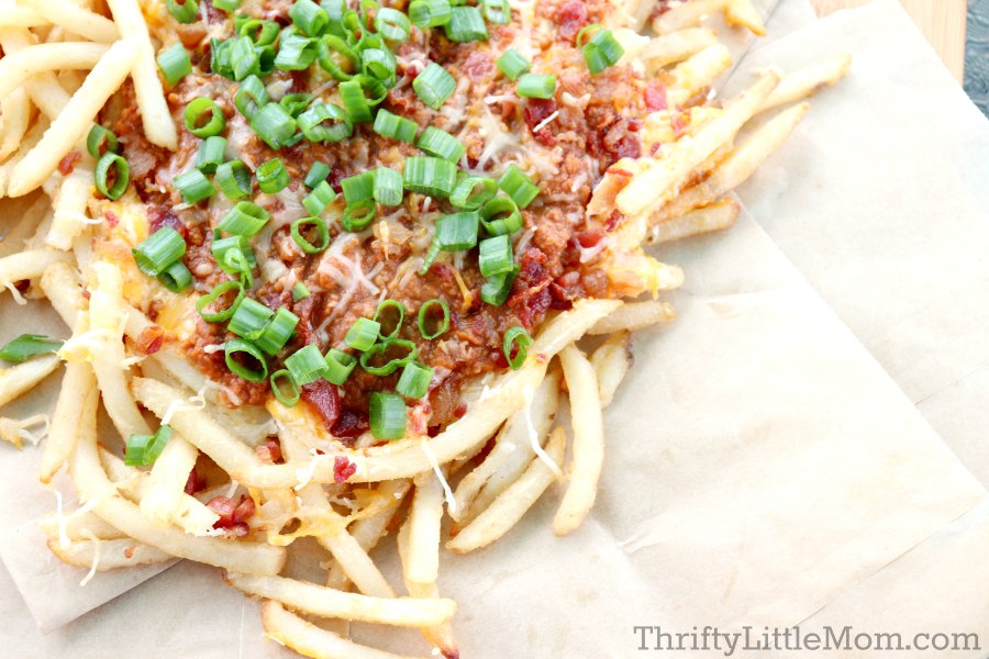 Pile of pimento cheese fries on brown paper 