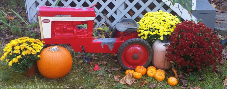 https://thriftylittlemom.com/wp-content/uploads/2019/09/Harvest-Decor-Mums-Pumpkins-and-Red-Tractor.jpg