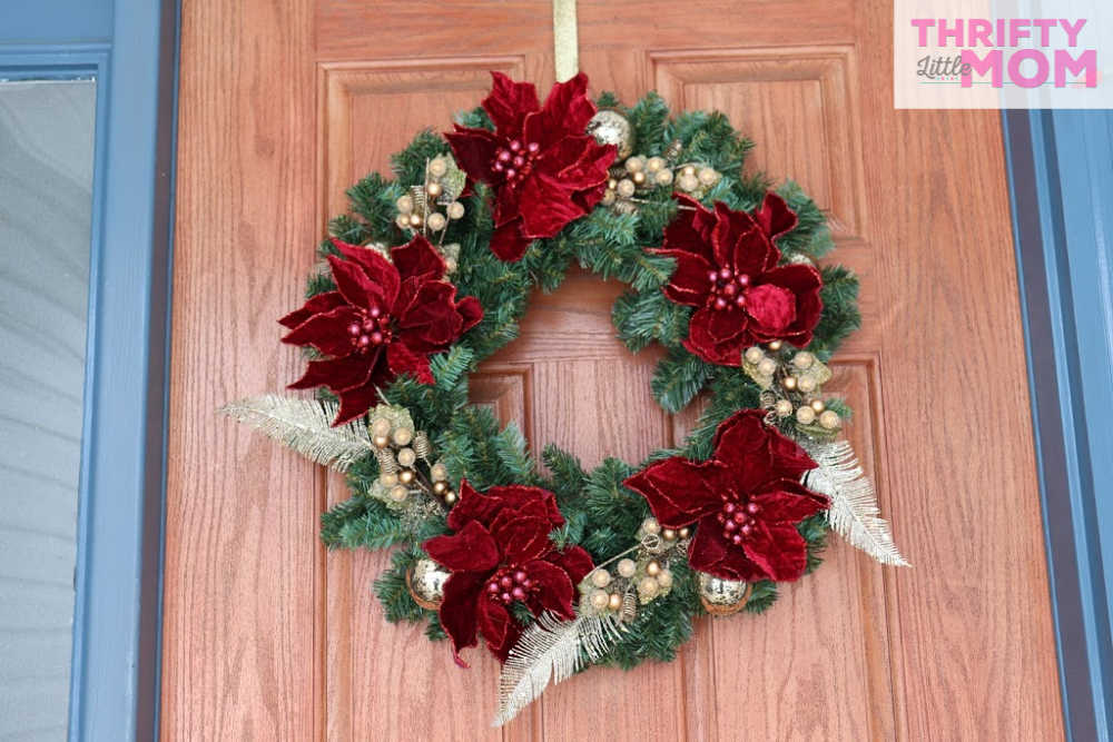 Christmas Wreath With Poinsettia and Peacock Ribbons