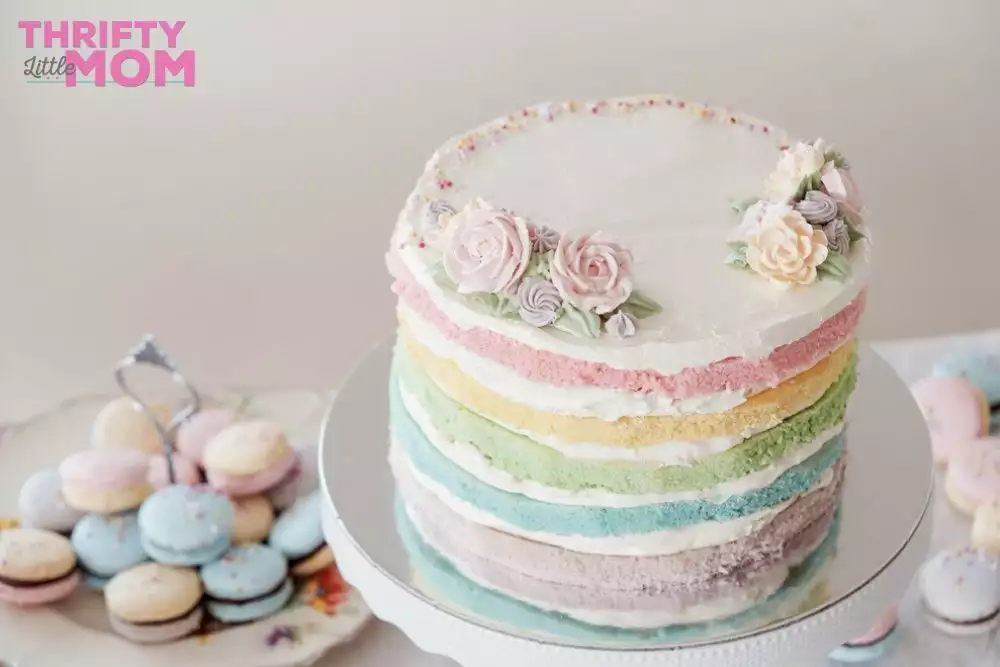 layered pastel rainbow cake with naked edge