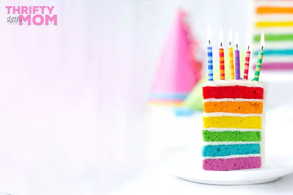 layered rainbow cake slice for party
