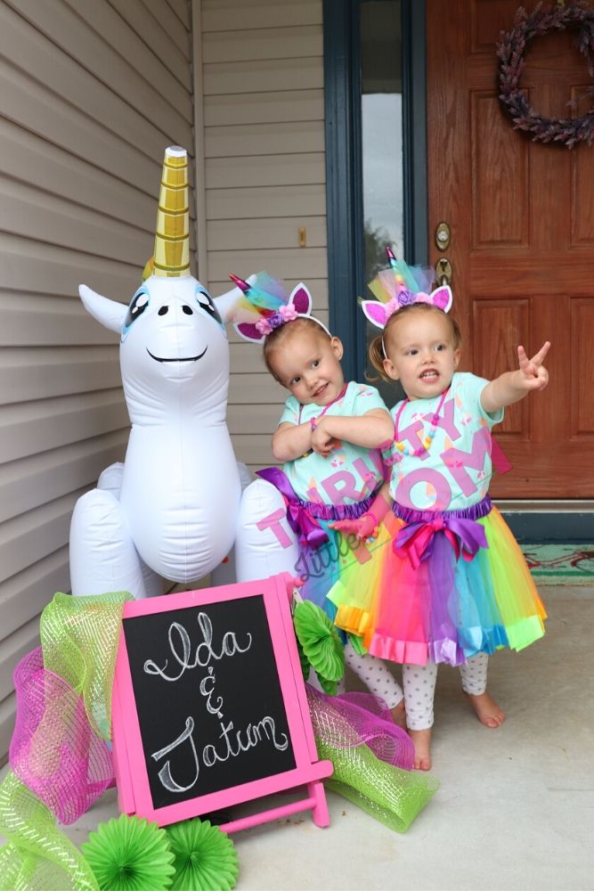 front entryway blowup unicorn and chalk board