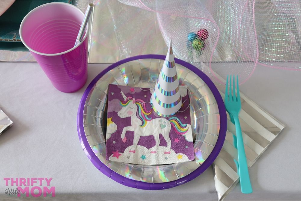 layered unicorn themed plates and napkins