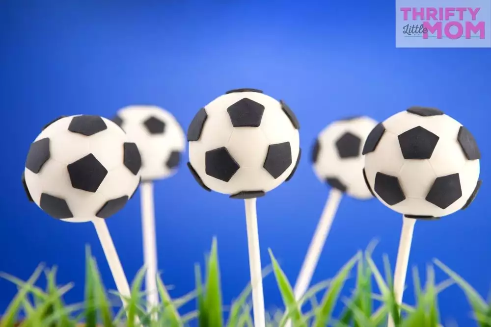 soccer ball cake pops make cute dessert at an 11 year old boy birthday party