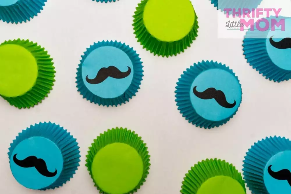 blue and green cupcake liners with mustaches for little man baby shower