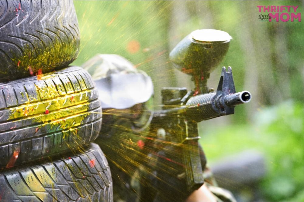 paintball splattering while hiding behind a barrier would make for a thrilling 11 year old boy birthday party idea